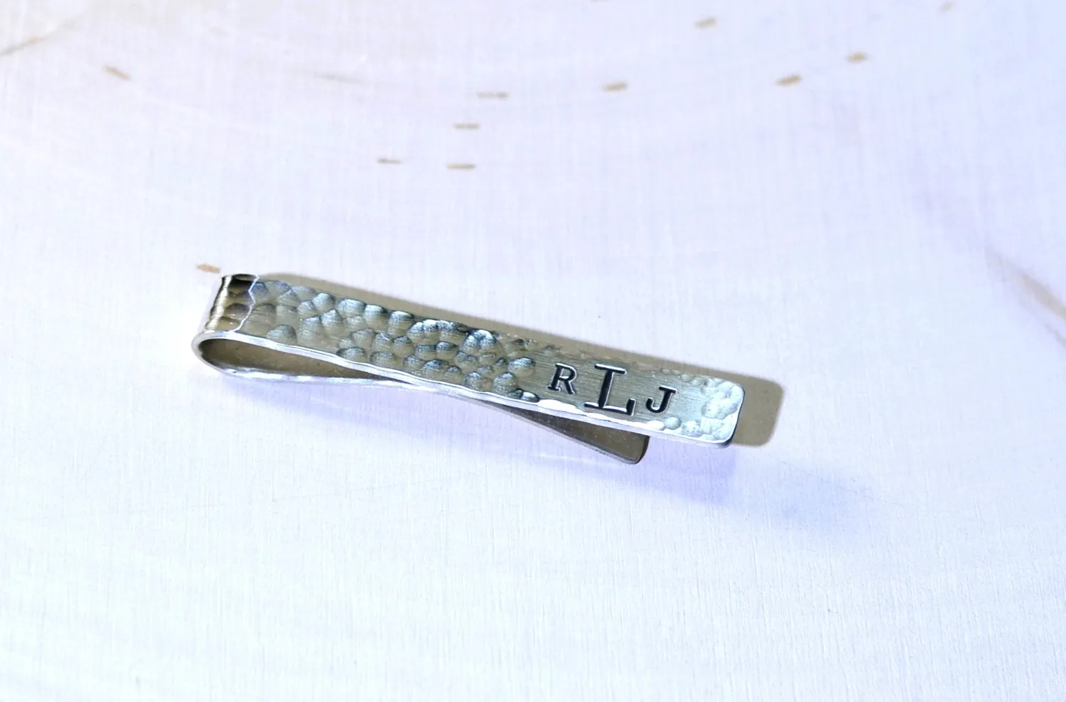 Hammered sterling silver tie clip with personalized monogram on tie bar
