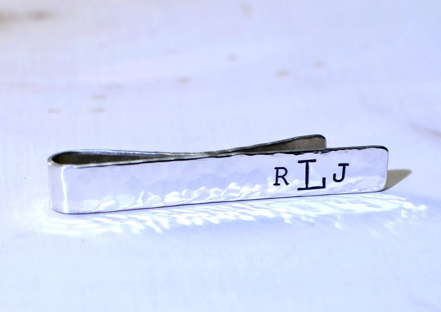Hammered sterling silver tie clip with personalized monogram on tie bar