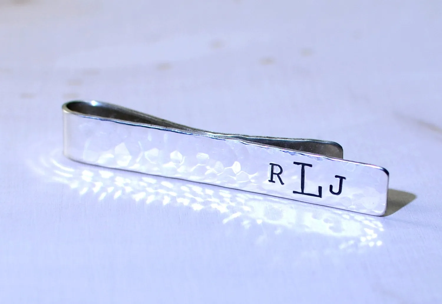 Hammered sterling silver tie clip with personalized monogram on tie bar